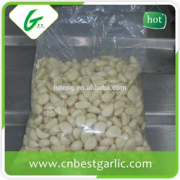White pure peeled frozen garlic cloves